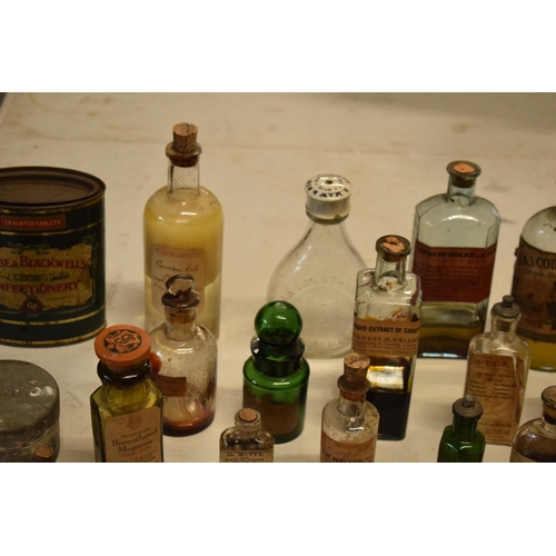 286 - A quantity of interesting early 20th century medicine and pesticide bottles, tins and jars etc (Some... 