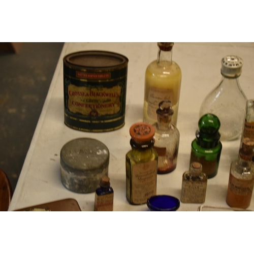 286 - A quantity of interesting early 20th century medicine and pesticide bottles, tins and jars etc (Some... 