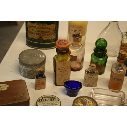 286 - A quantity of interesting early 20th century medicine and pesticide bottles, tins and jars etc (Some... 