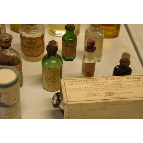 286 - A quantity of interesting early 20th century medicine and pesticide bottles, tins and jars etc (Some... 