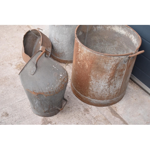 289 - A collection of early 20th century tin bins, anti spill milking bucket and a mesh sorting bucket by ... 