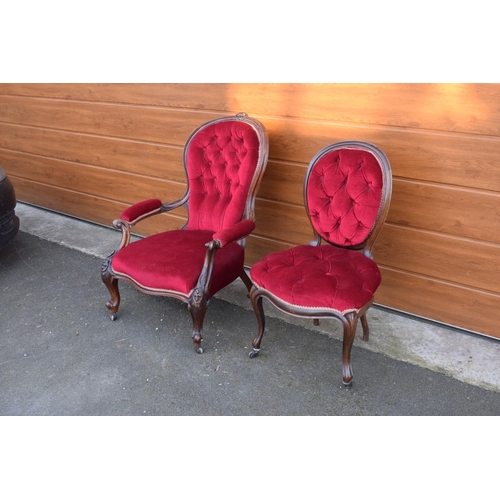 296 - A pair of Edwardian upholstered His and Hers chairs on casters. Signs of old worm. There have been s... 