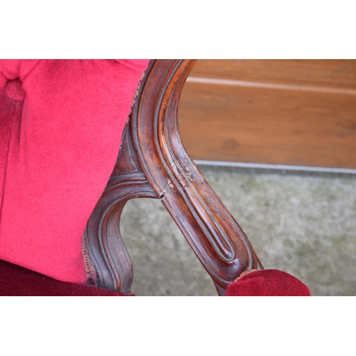 296 - A pair of Edwardian upholstered His and Hers chairs on casters. Signs of old worm. There have been s... 