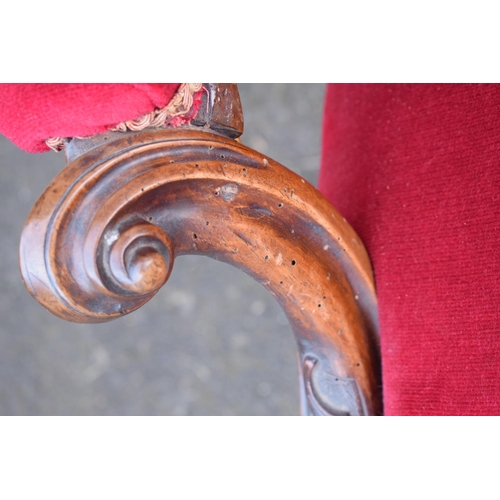 296 - A pair of Edwardian upholstered His and Hers chairs on casters. Signs of old worm. There have been s... 