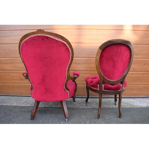 296 - A pair of Edwardian upholstered His and Hers chairs on casters. Signs of old worm. There have been s... 