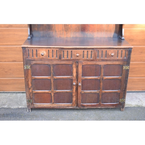 297 - 1930s oak dresser and rack. No back to it. Doors don't stay shut. 124 x 47 x 178cm.