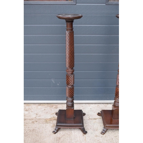 298 - Pair of Victorian mahogany plant stands/ torcheres. One had been converted to a lamp base and still ... 