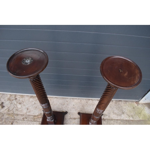 298 - Pair of Victorian mahogany plant stands/ torcheres. One had been converted to a lamp base and still ... 