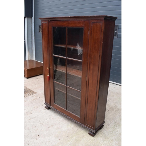 306 - Large Victorian mahogany bookcase on carved feet with foldout sides and a glass panelled door. 3 adj... 