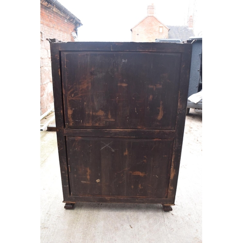 306 - Large Victorian mahogany bookcase on carved feet with foldout sides and a glass panelled door. 3 adj... 