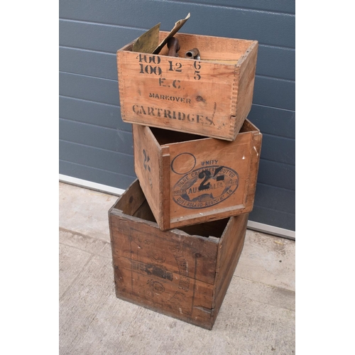 311 - A collection of wooden advertising crates plus an iron with fuel. 50 x 40 x 44cm largest.