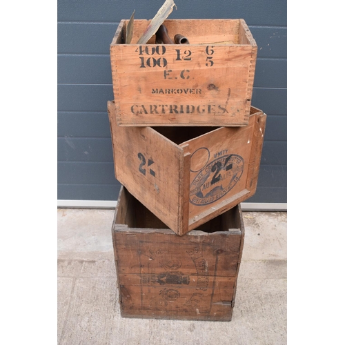 311 - A collection of wooden advertising crates plus an iron with fuel. 50 x 40 x 44cm largest.