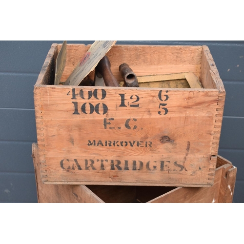 311 - A collection of wooden advertising crates plus an iron with fuel. 50 x 40 x 44cm largest.