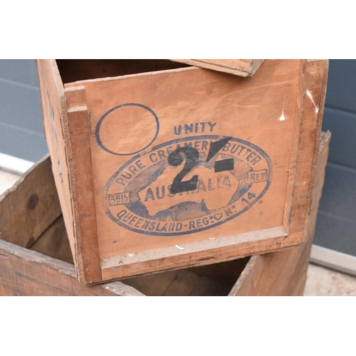 311 - A collection of wooden advertising crates plus an iron with fuel. 50 x 40 x 44cm largest.