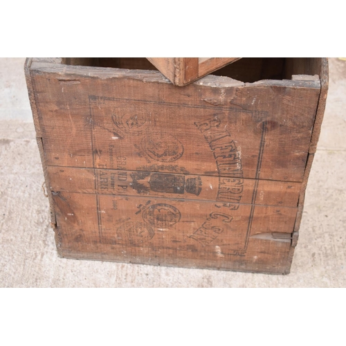 311 - A collection of wooden advertising crates plus an iron with fuel. 50 x 40 x 44cm largest.