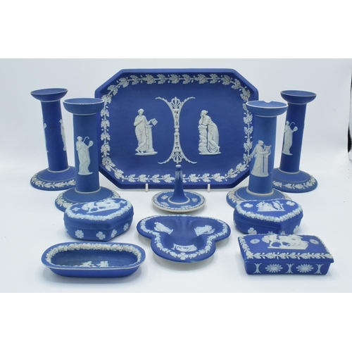 52 - A good collection of Wedgwood Jasperware in the dip blue colour to include 2 pairs of candlesticks, ... 