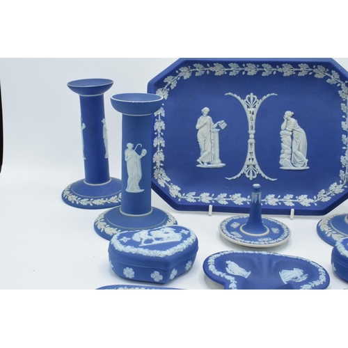 52 - A good collection of Wedgwood Jasperware in the dip blue colour to include 2 pairs of candlesticks, ... 