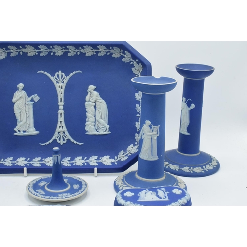 52 - A good collection of Wedgwood Jasperware in the dip blue colour to include 2 pairs of candlesticks, ... 