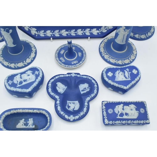 52 - A good collection of Wedgwood Jasperware in the dip blue colour to include 2 pairs of candlesticks, ... 