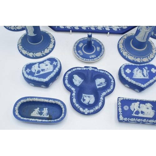 52 - A good collection of Wedgwood Jasperware in the dip blue colour to include 2 pairs of candlesticks, ... 