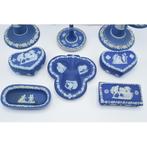 52 - A good collection of Wedgwood Jasperware in the dip blue colour to include 2 pairs of candlesticks, ... 