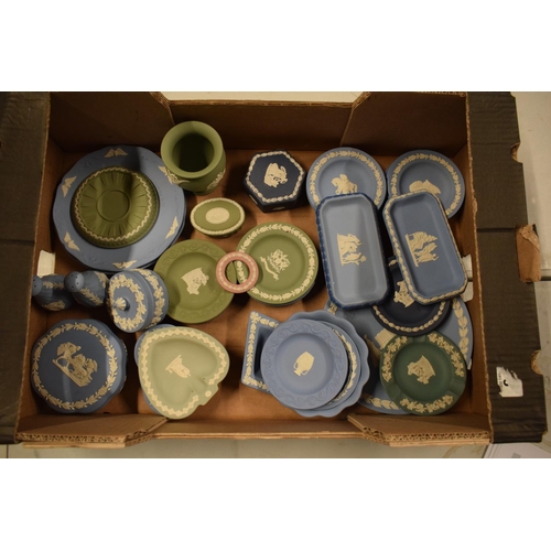 53 - A collection of Wedgwood Jasperware to include vases, trinkets, cruets etc in a range of colours to ... 