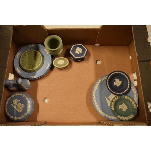 53 - A collection of Wedgwood Jasperware to include vases, trinkets, cruets etc in a range of colours to ... 