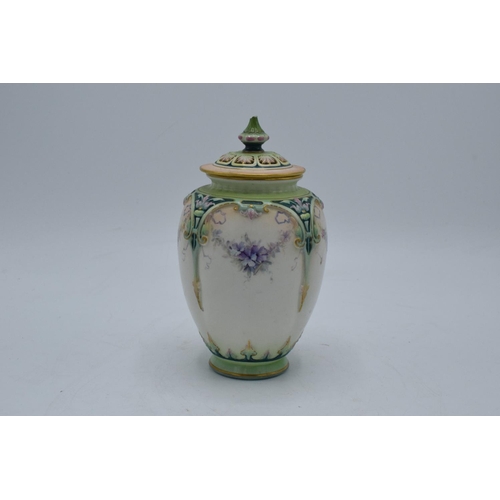 63 - Hadley's Worcester faience lidded vase with a guilded floral decoration. In good condition with no o... 