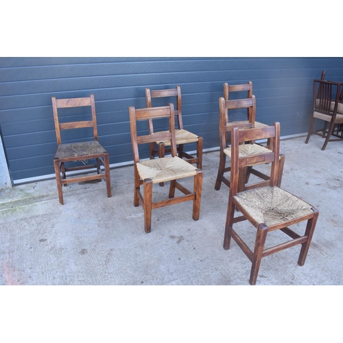 324 - A collection of 6 Victorian ladder back farmhouse chairs with rush seats (All near matching) (6). In... 