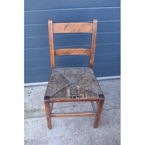 324 - A collection of 6 Victorian ladder back farmhouse chairs with rush seats (All near matching) (6). In... 