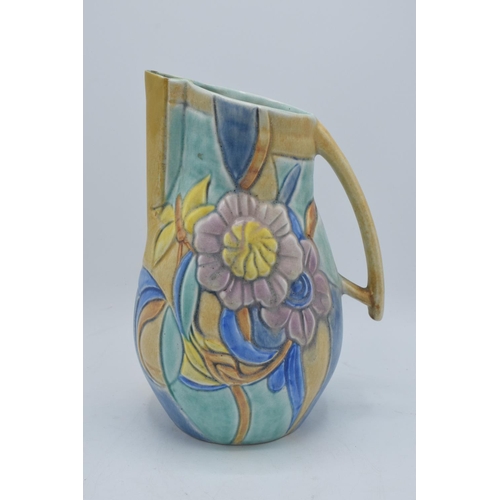 106A - Beswick art deco jug with a floral design. Some restoration to the spout of the jug. 28cm tall.