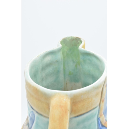 106A - Beswick art deco jug with a floral design. Some restoration to the spout of the jug. 28cm tall.