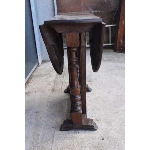 304 - 18th century thick oak drop-leaf gate leg table. 74cm tall.