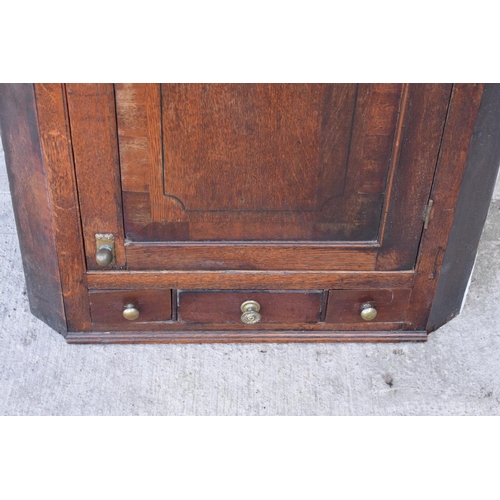 313 - Georgian oak corner cupboard with 3 drawers.  with age related wear.  105 x 76 x 46cm