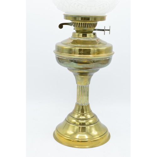 100 - A large Edwardian brass oil lamp complete with an associated funnel and shade. In good condition. Ch... 