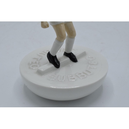 122 - Royal Doulton Subbuteo figure in a white kit with black boots. This is a trial piece and only has th... 