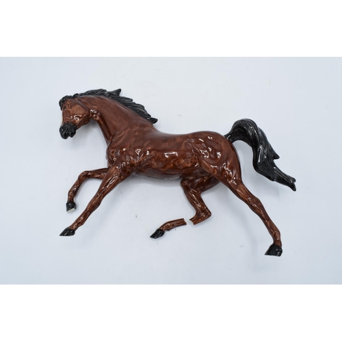 140 - An interesting Royal Doulton model of a galloping horse in a brown colourway with a Royal Doulton ba... 