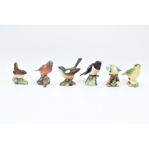 160 - A collection of Beswick birds to include a Wren, Chaffinch, Whitethroat, stone chat, blue tit ands a... 