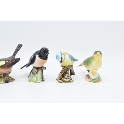 160 - A collection of Beswick birds to include a Wren, Chaffinch, Whitethroat, stone chat, blue tit ands a... 