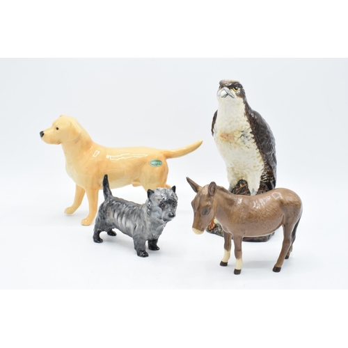 165 - A collection of Beswick to include a donkey, a large golden retriever together with a Royal Doulton ... 