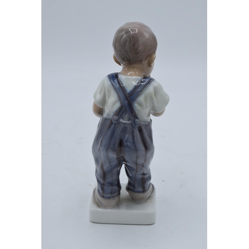 200 - Dahl Jensen of Copenhagen figure of a boy with pipe 1027. In good condition with no obvious damage o... 