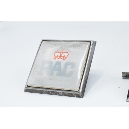 201 - A trio of items to include a silver handled cake slice, a vintage RAC badge and a vintage AA badge (... 