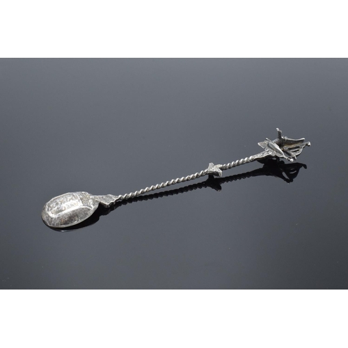 203 - 19th century ornate Dutch silver spoon with a coat of arms to the actual spoon and a man sailing a b... 