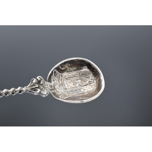 203 - 19th century ornate Dutch silver spoon with a coat of arms to the actual spoon and a man sailing a b... 