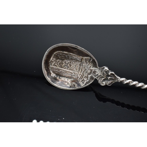 203 - 19th century ornate Dutch silver spoon with a coat of arms to the actual spoon and a man sailing a b... 