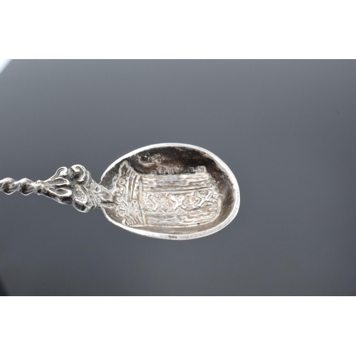 203 - 19th century ornate Dutch silver spoon with a coat of arms to the actual spoon and a man sailing a b... 