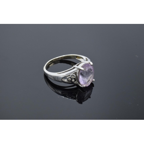 216 - 9ct white gold ladies ring set with a pink stone. Gross weight 4.1 grams. Size R.