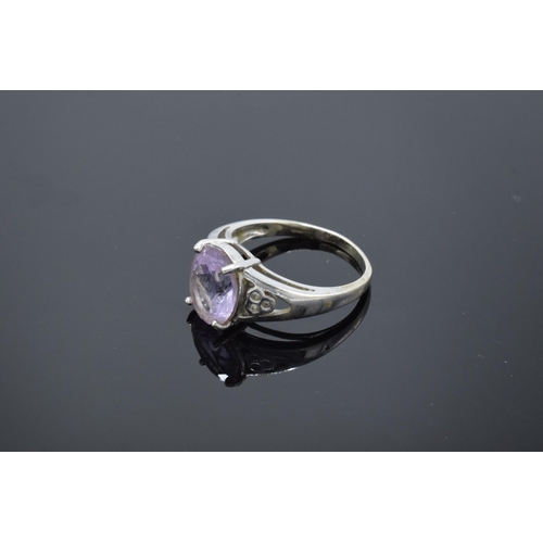 216 - 9ct white gold ladies ring set with a pink stone. Gross weight 4.1 grams. Size R.