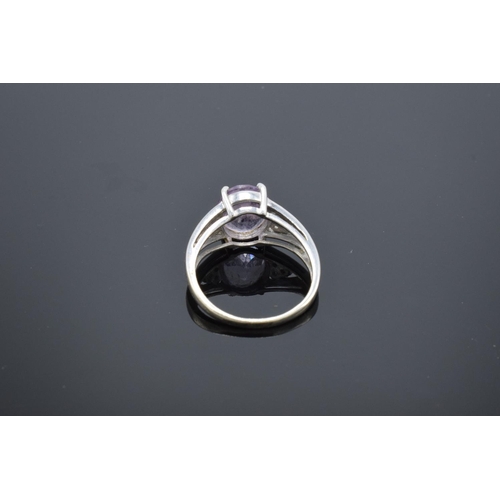 216 - 9ct white gold ladies ring set with a pink stone. Gross weight 4.1 grams. Size R.