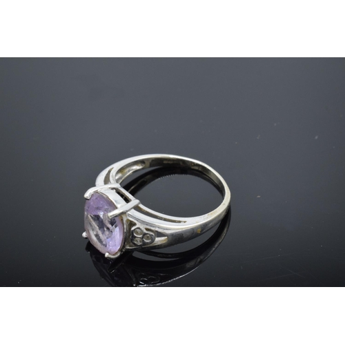 216 - 9ct white gold ladies ring set with a pink stone. Gross weight 4.1 grams. Size R.